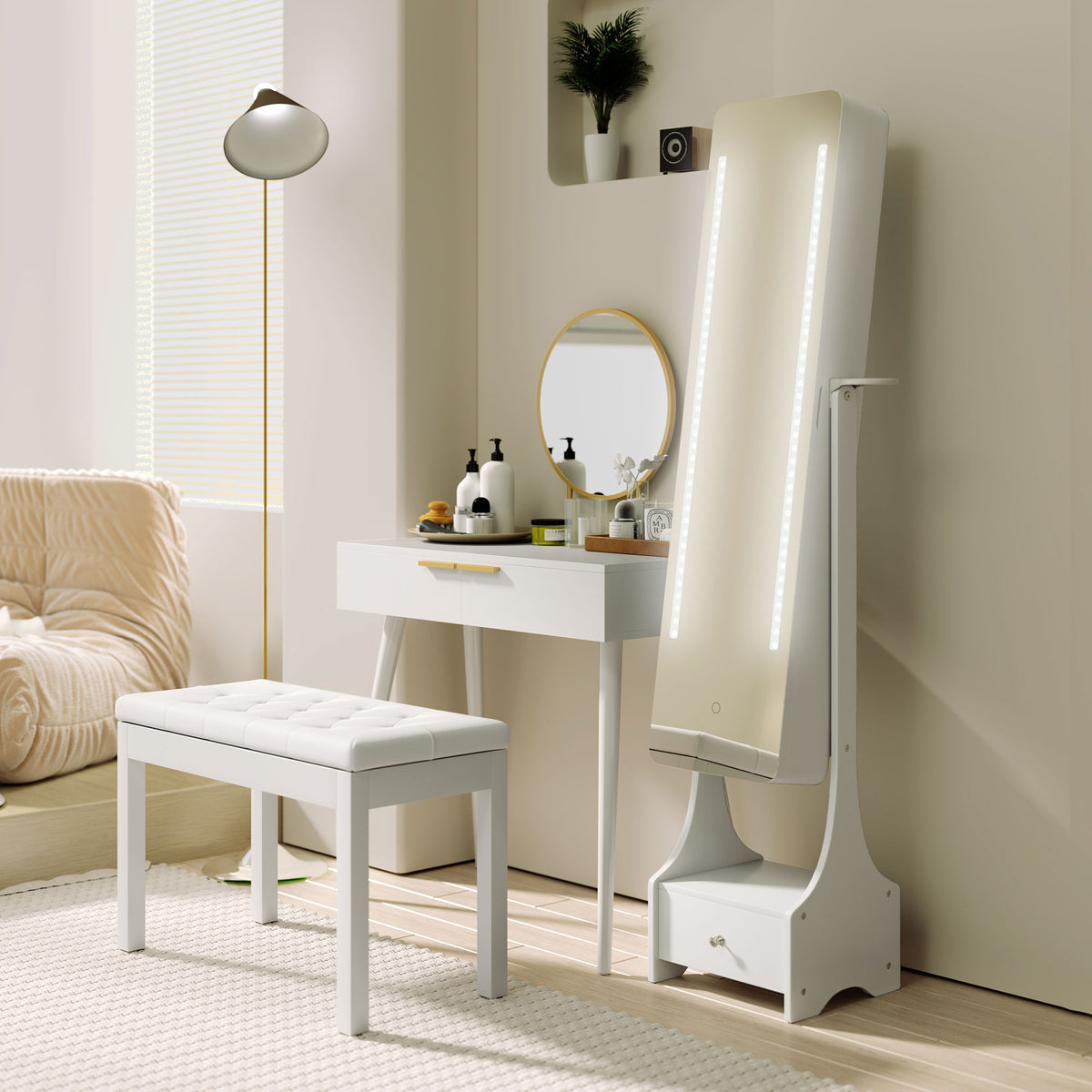 White dressing table with round mirror and gold handle beside a vanity mirror