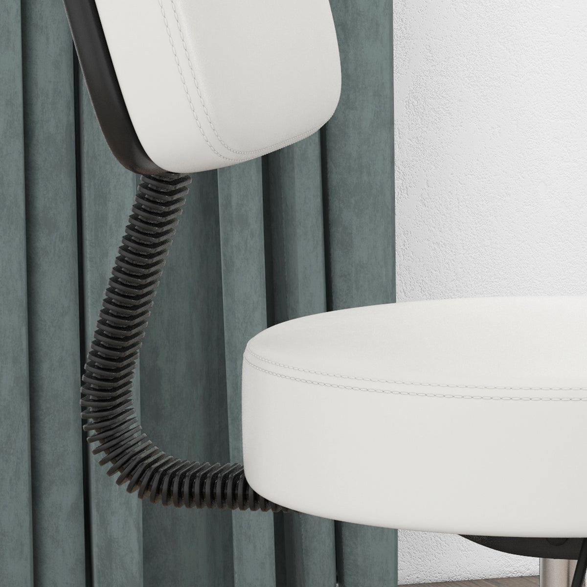 Close-up of the white salon chair's padded seat and flexible backrest support
