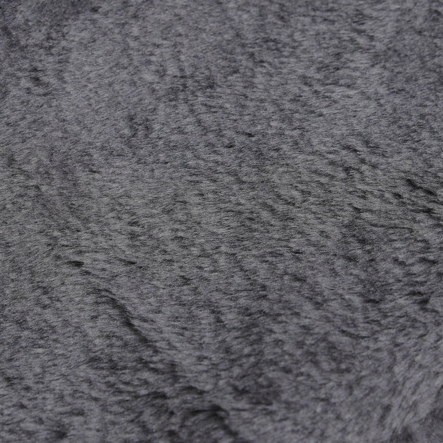 Close-up of the dark gray plush stair cover's soft, textured fabric