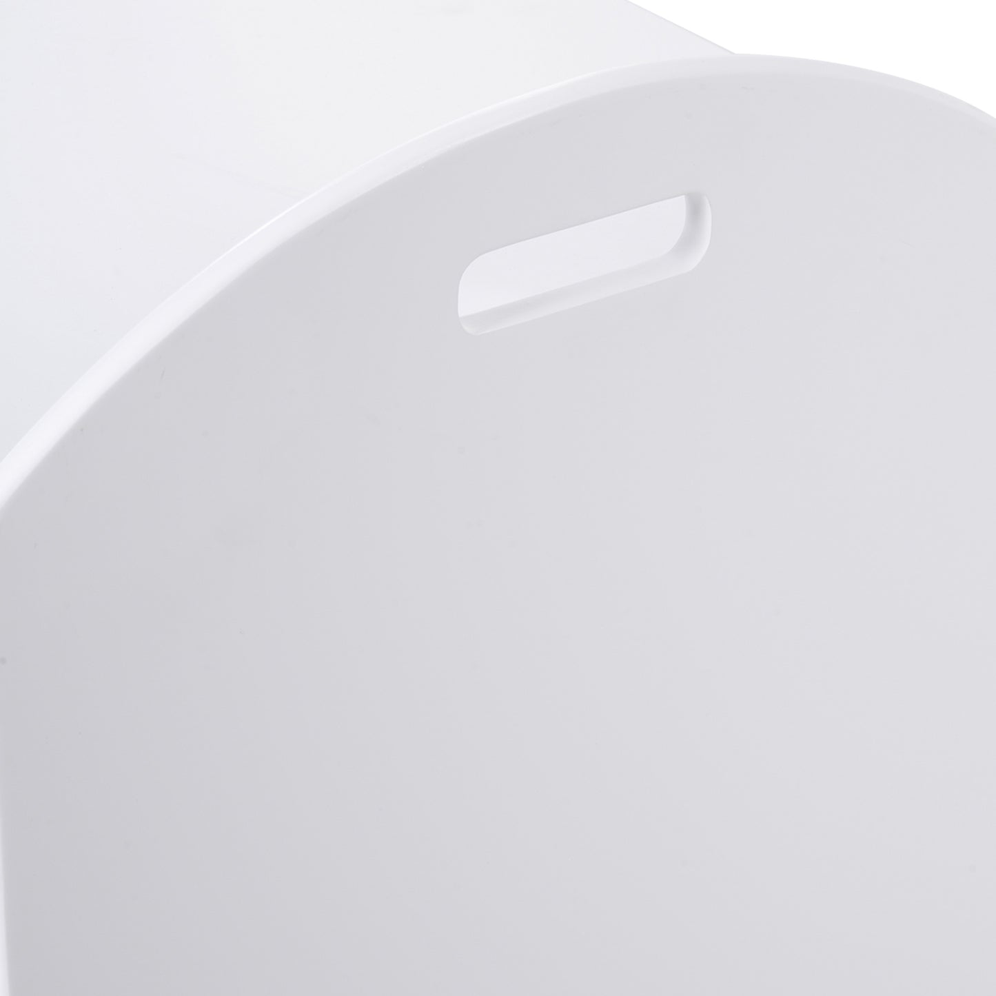 Close-up of the oval carry handle cut into the white toy chest side