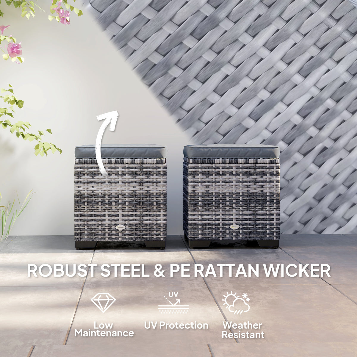Pair of dark gray rattan ottomans with cushioned lids and woven construction