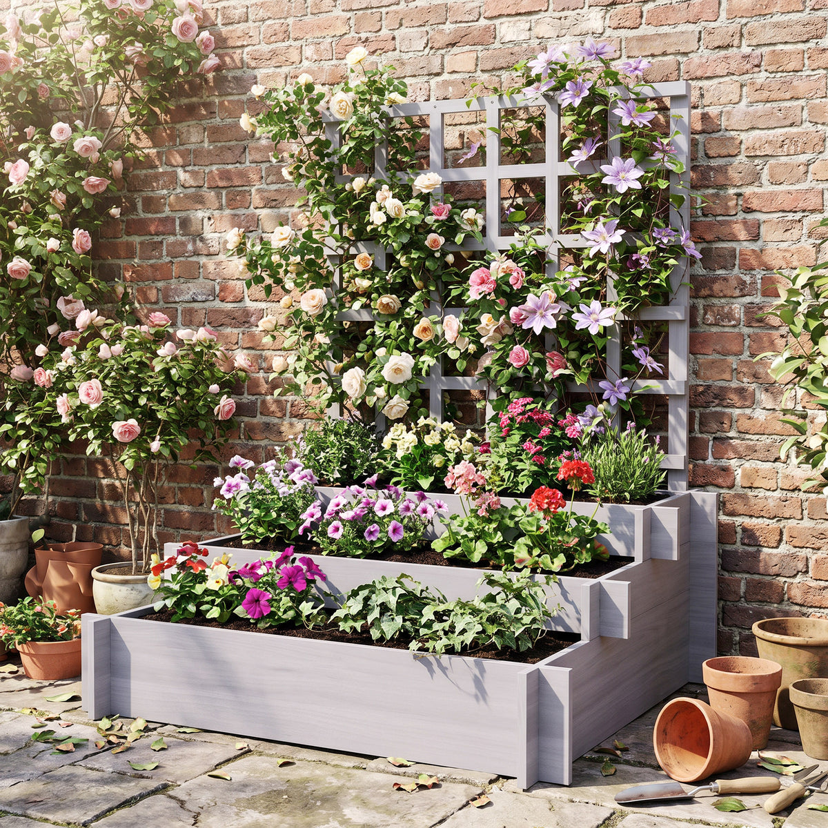 Grey raised planter and trellis filled with colorful flowering plants