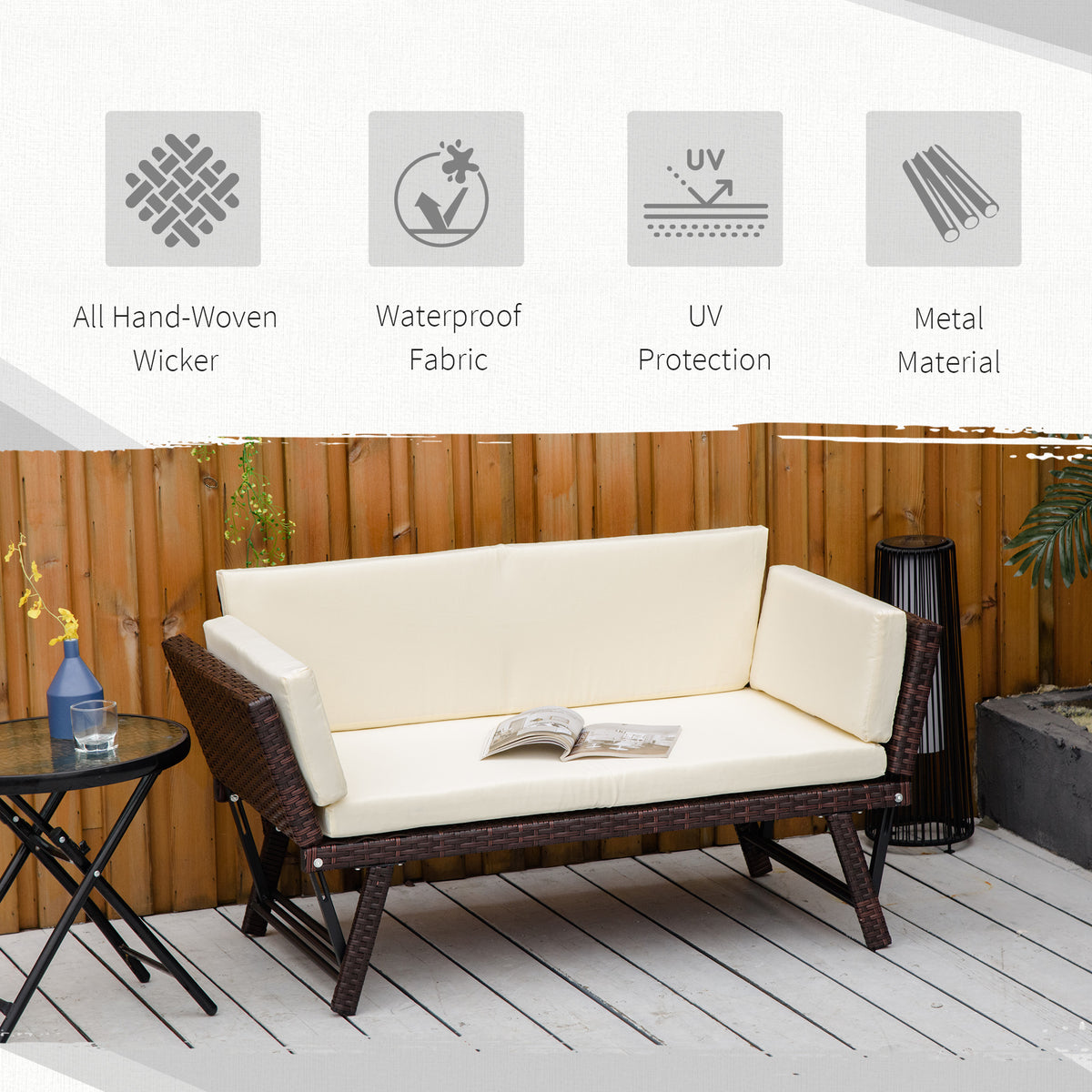 Brown hand-woven rattan daybed with cream cushions and black metal frame