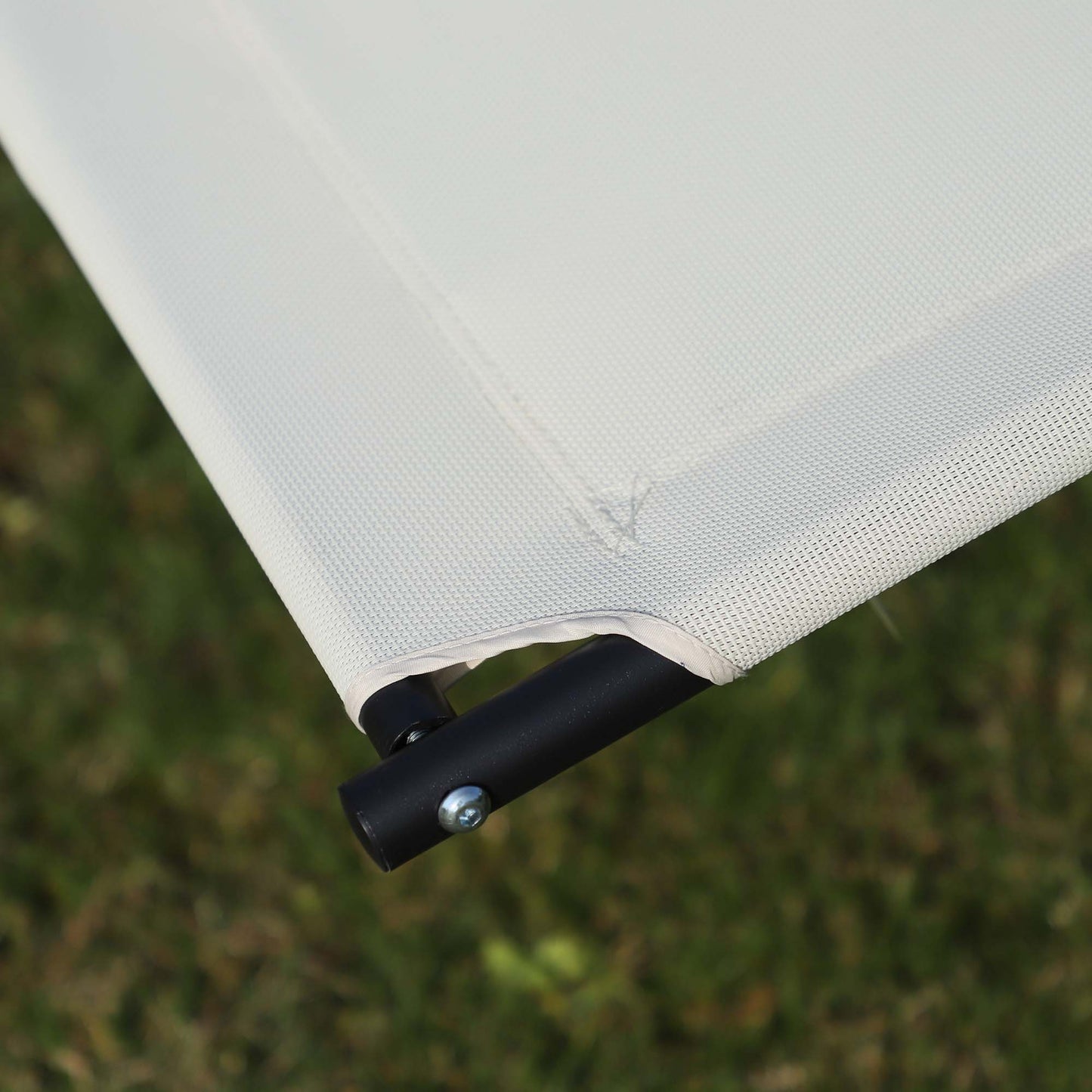Outsunny lounger detail showing cream woven fabric secured to the black frame