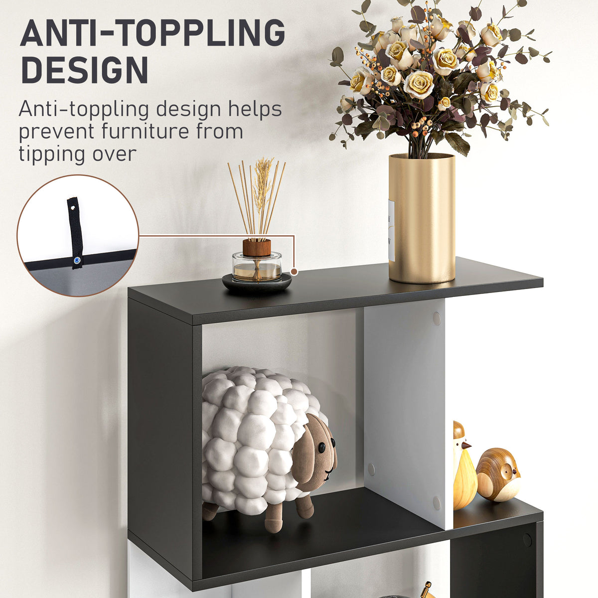 Close-up of a black and white bookshelf shelf with an anti-tip wall strap