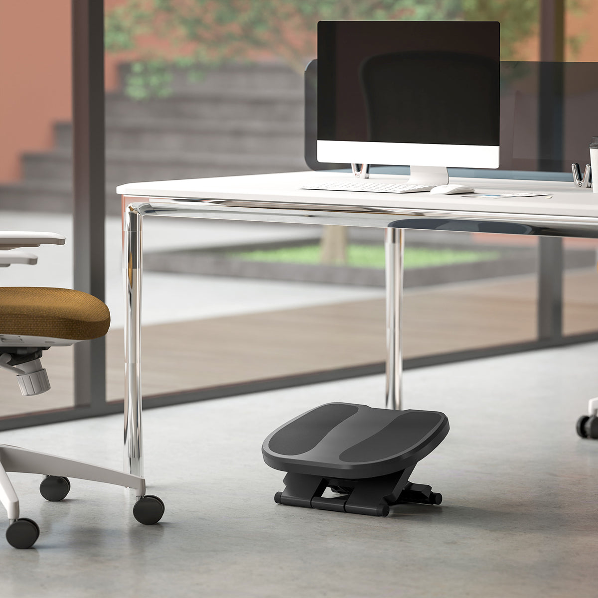 HOMCOM adjustable footrest positioned beneath an office desk