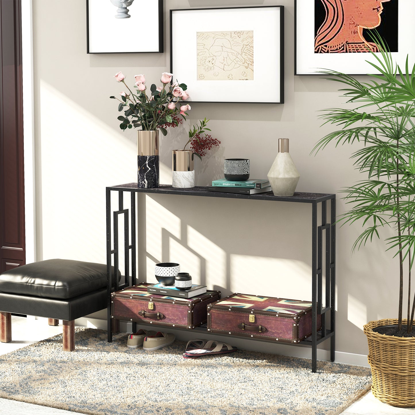 Black metal console table with two dark shelves, shown behind decorative storage trunks
