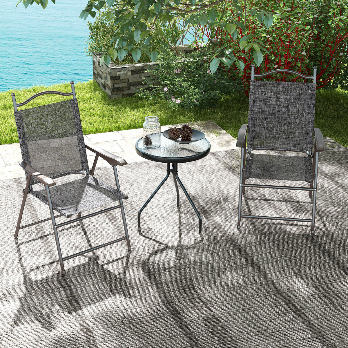 Two gray mesh folding garden chairs with dark frames and armrests