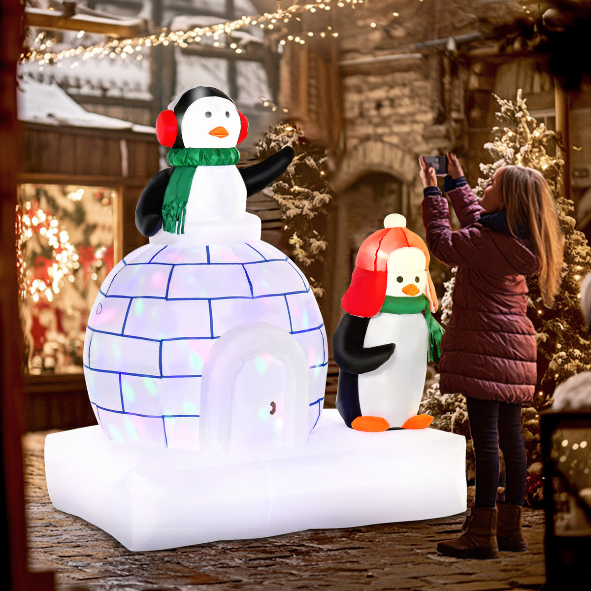 HOMCOM inflatable Christmas penguins with an igloo, scarves, and built-in lights
