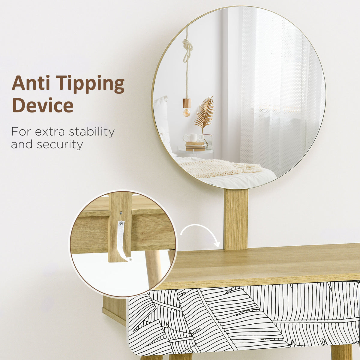 Dressing table with round mirror, patterned drawer, and anti-tip wall attachment.