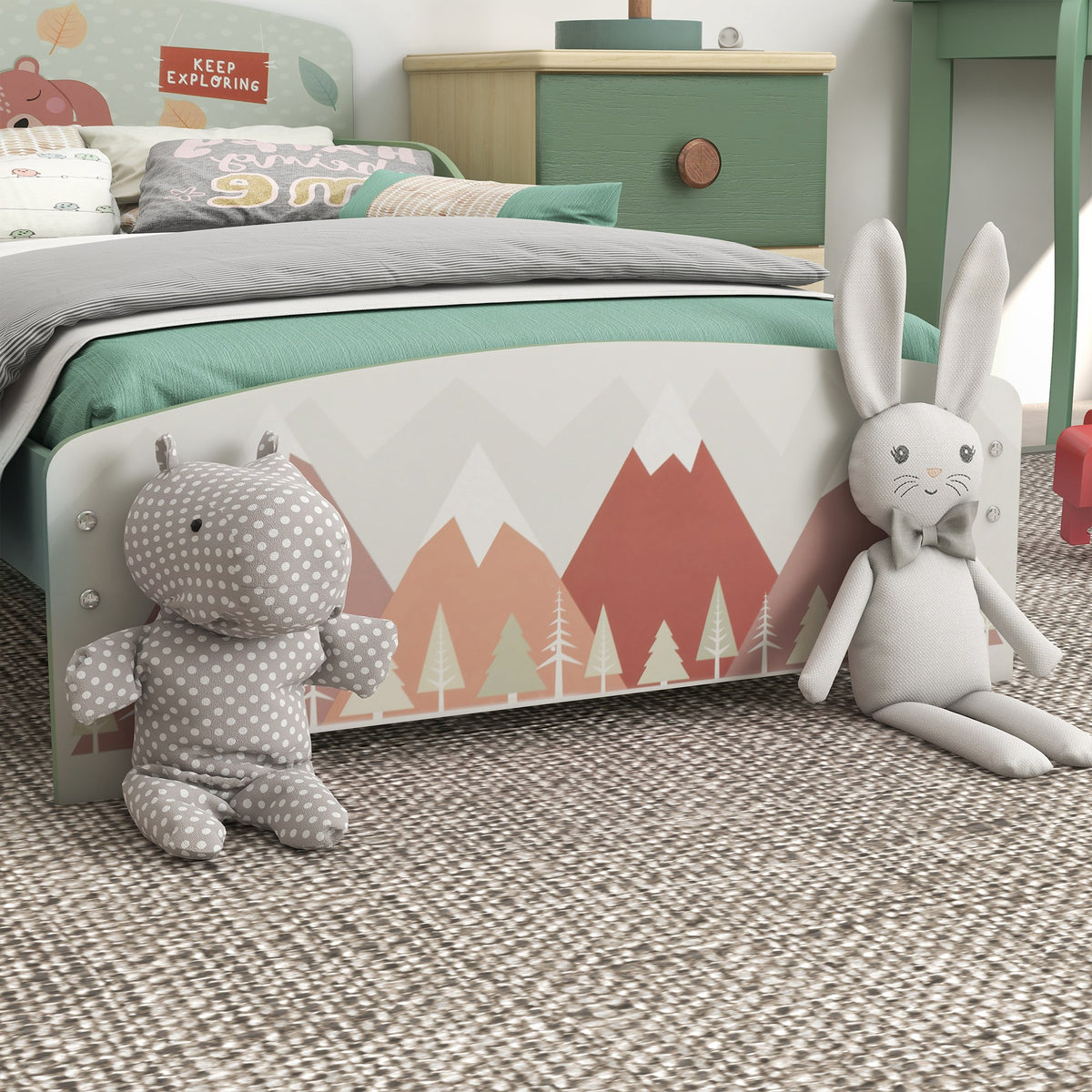 Close-up of ZONEKIZ bed's mountain-print footboard and green frame