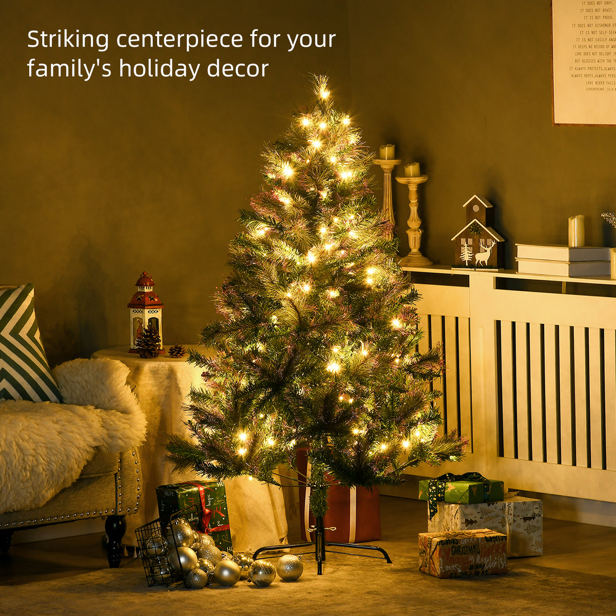 Lit artificial spruce Christmas tree displayed with warm white lights