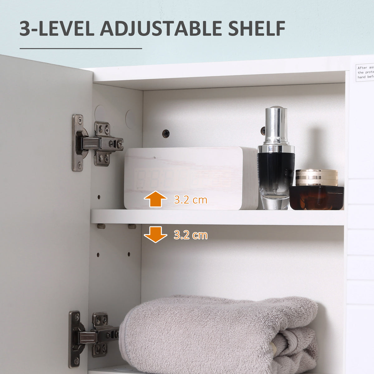 Open white mirror cabinet showing a three-level adjustable shelf and toiletries