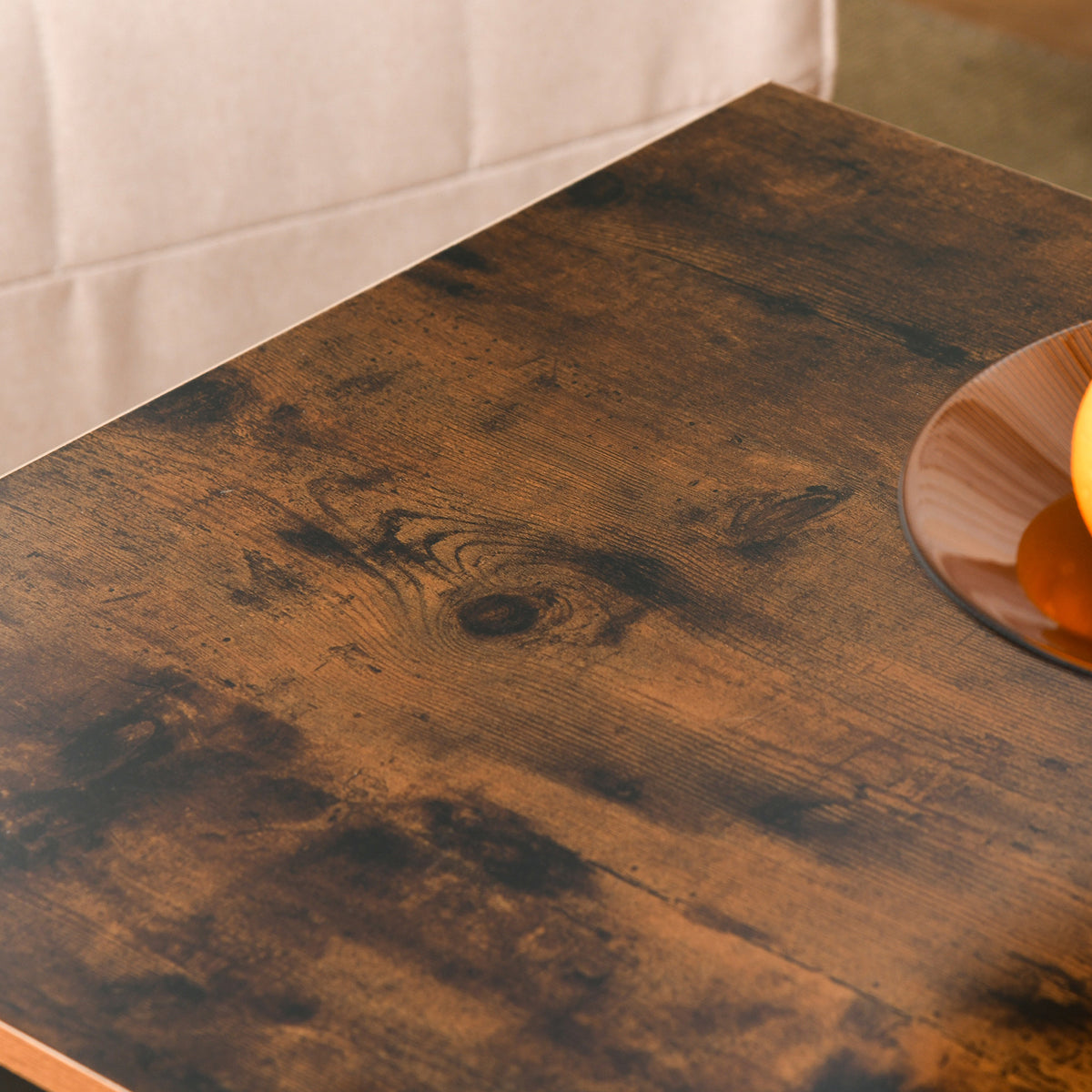 Coffee table close-up showing its rustic brown wood-look tabletop