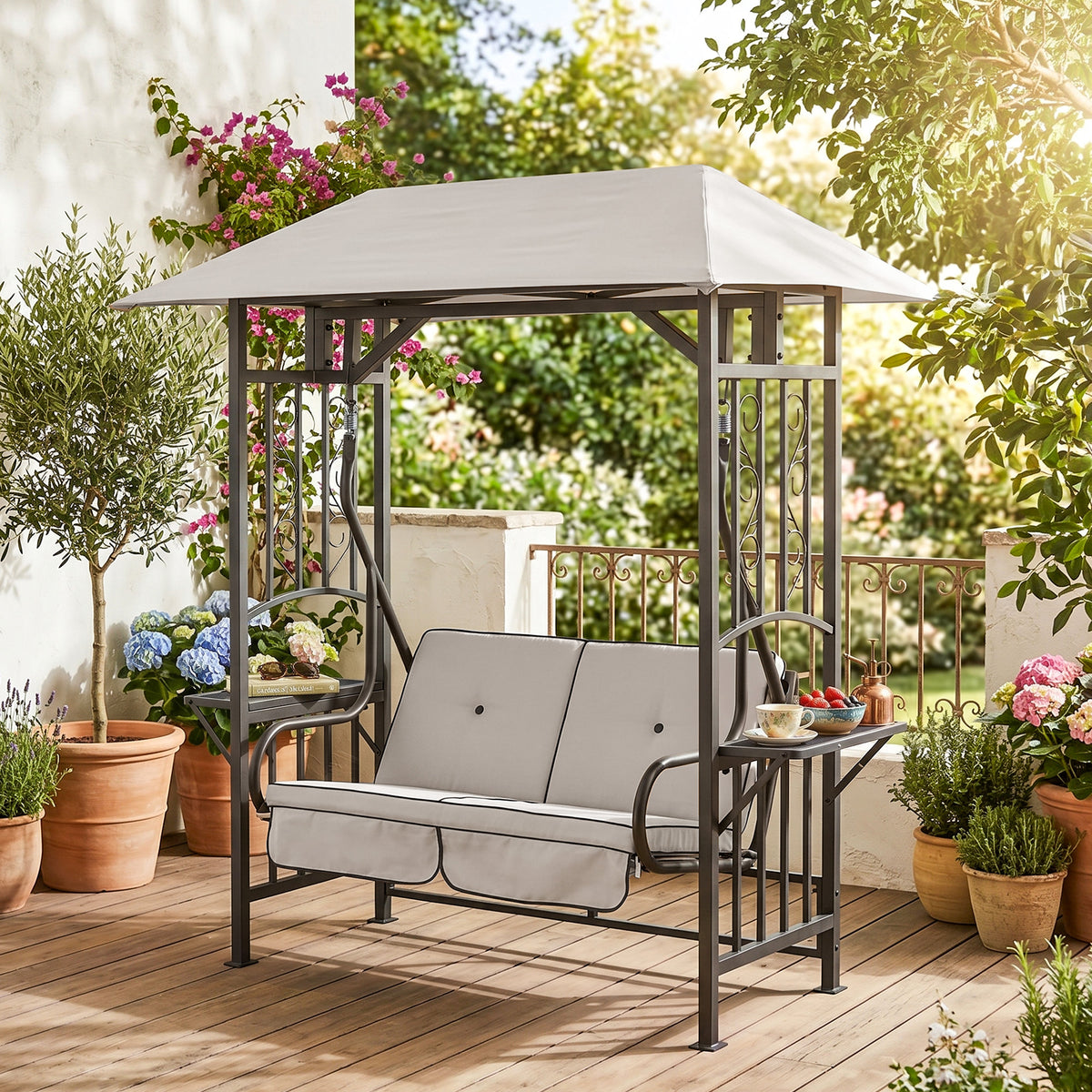 Two-seat canopy swing chair with beige cushions, steel frame, and side tables