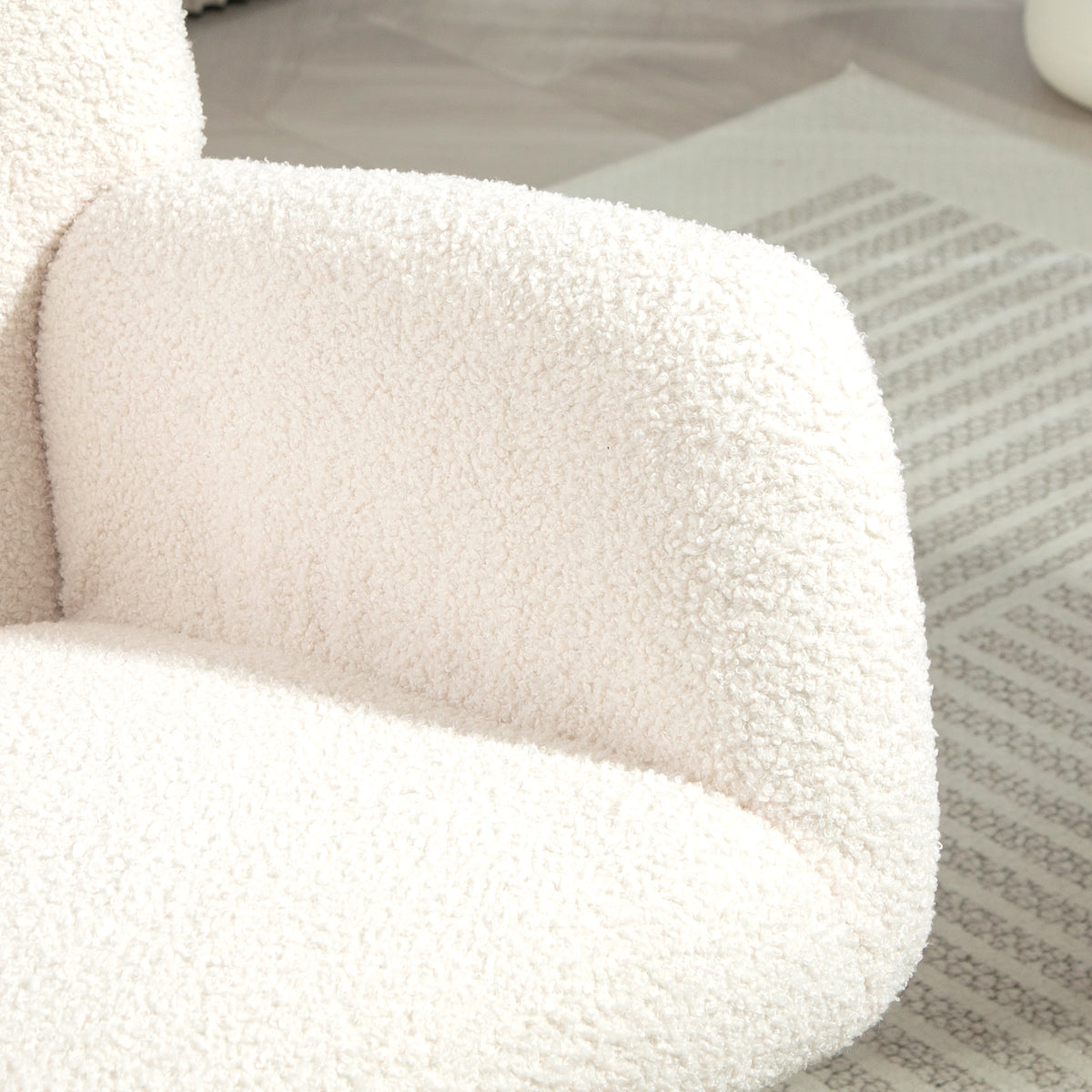 Close-up of teddy fleece rocking chair armrest and seat upholstery