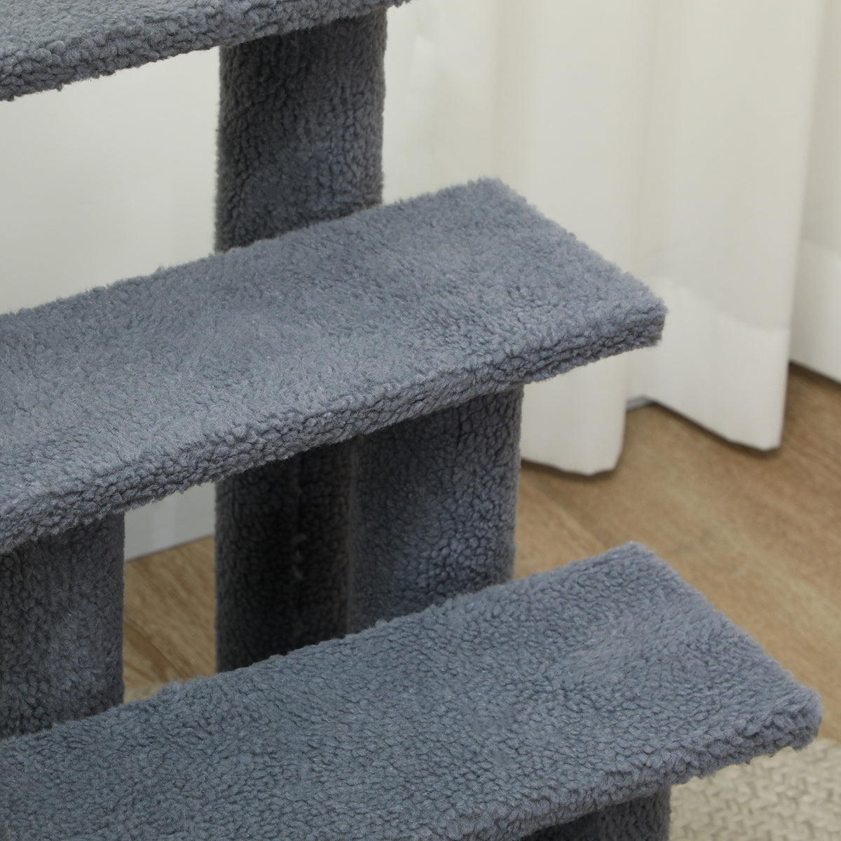 Close-up of the soft grey plush covering on the pet stair steps
