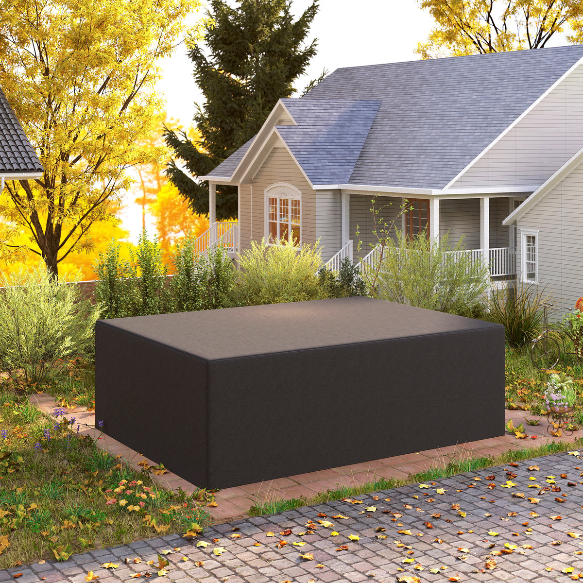 Black outdoor furniture cover protecting a rectangular garden sofa set
