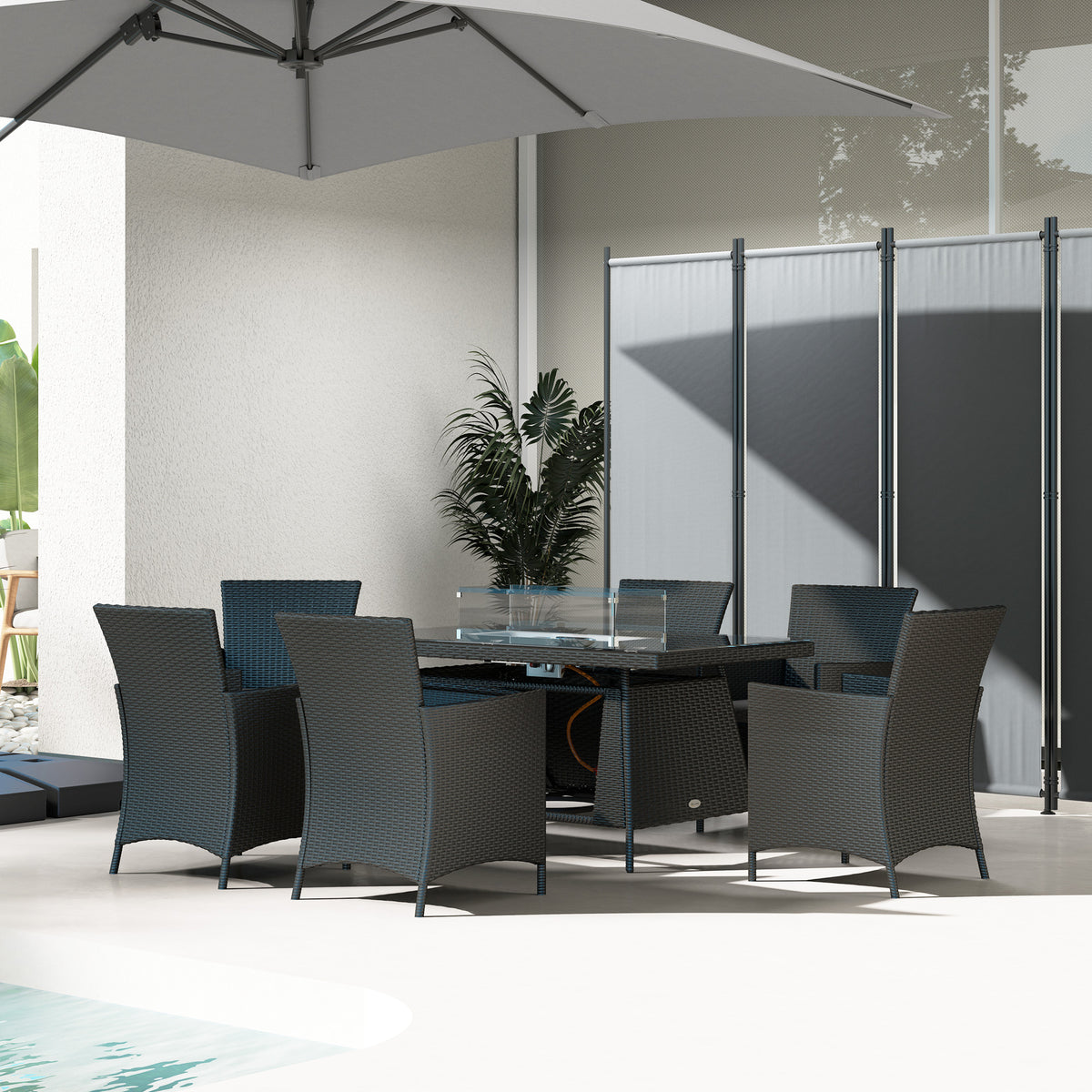 Black rattan fire pit dining set with six chairs and glass windscreen