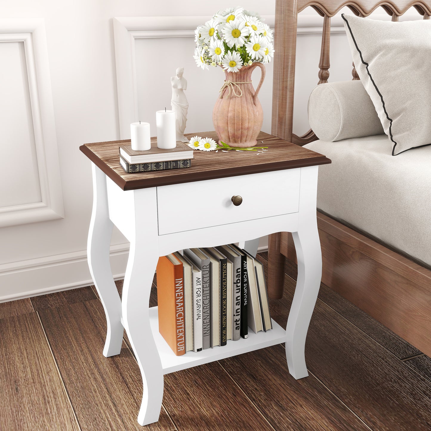 White bedside table with brown top, drawer and open shelf displaying books