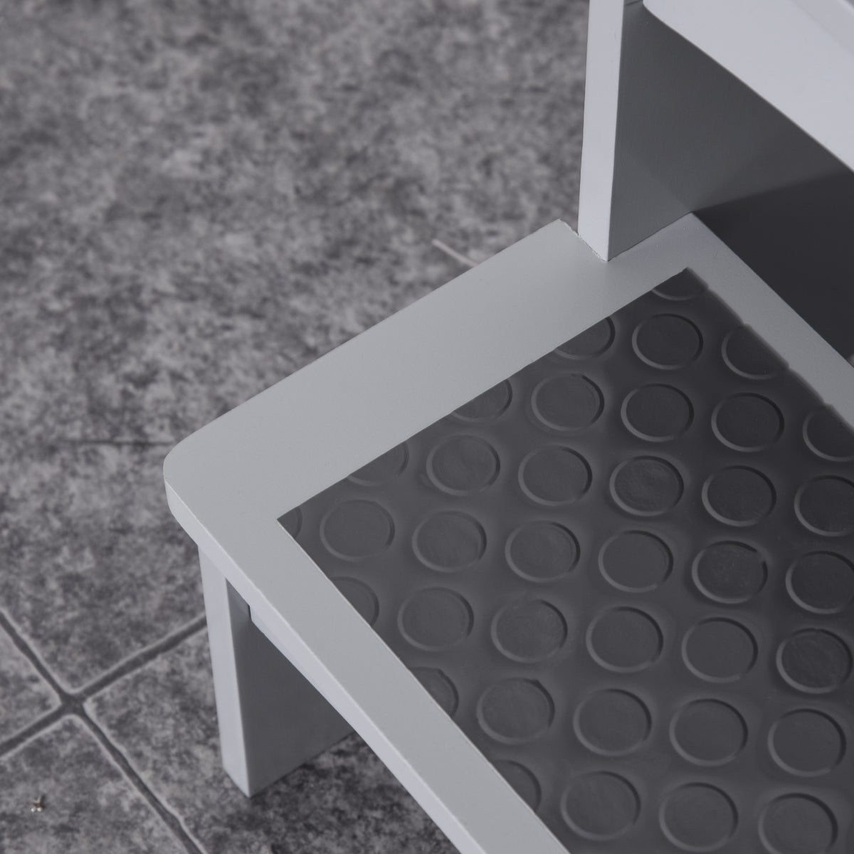 Close-up of the stool's textured, non-slip step panel
