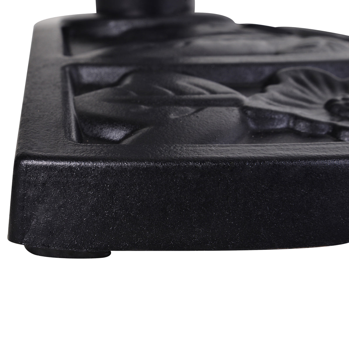 Close-up of the textured resin edge and raised floral detail on the parasol base