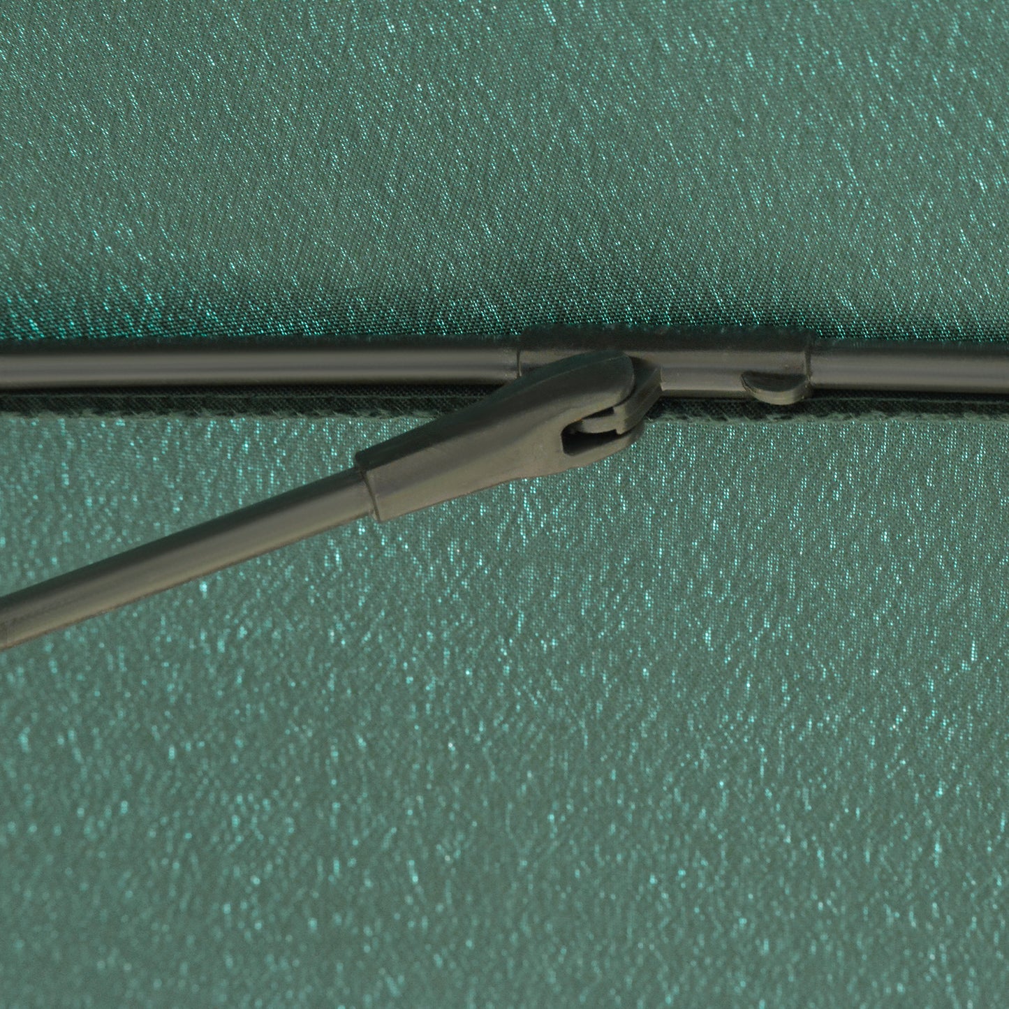 Close-up of the garden parasol canopy support joint and rib connector