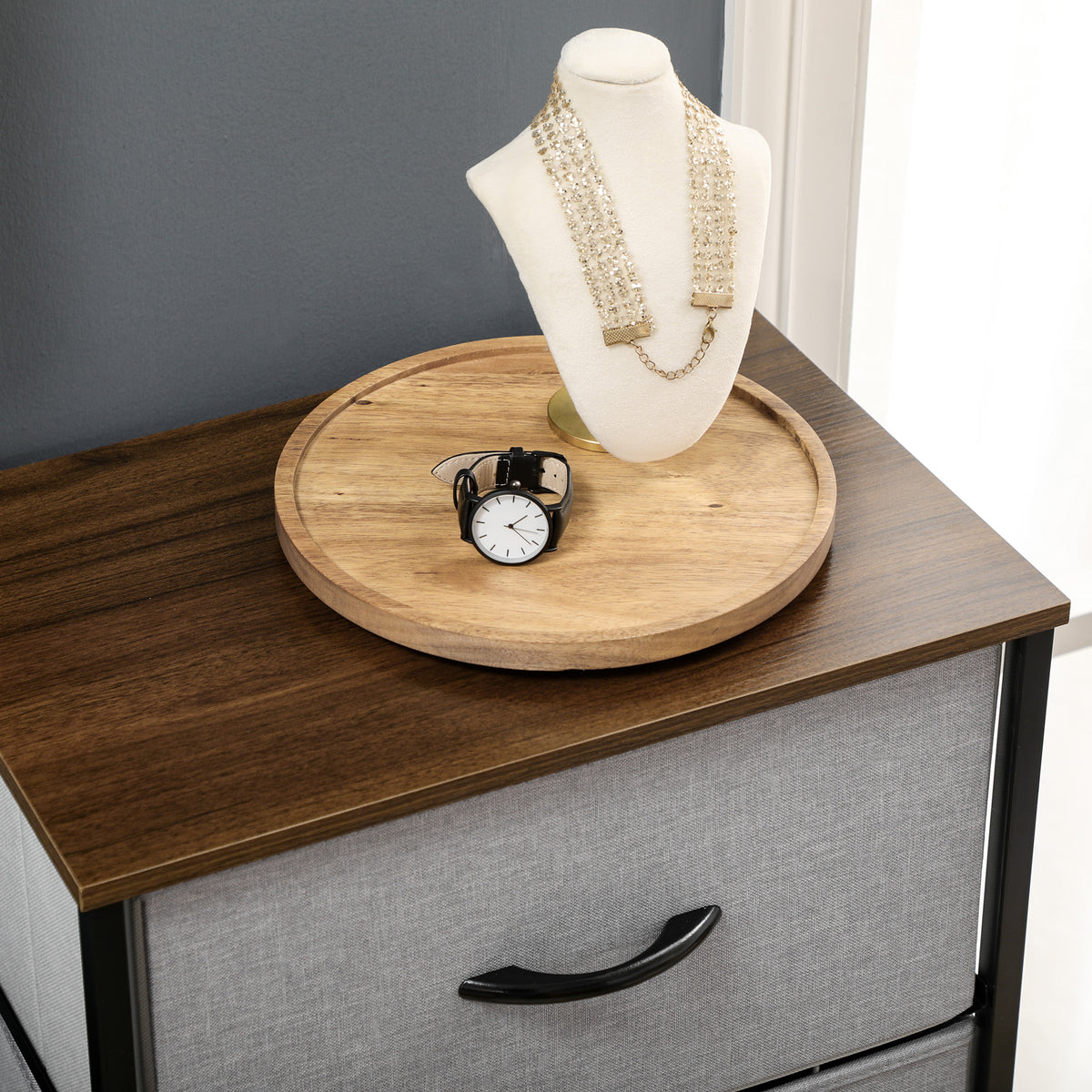 Fabric chest detail showing the wood top, gray drawer, and black handle