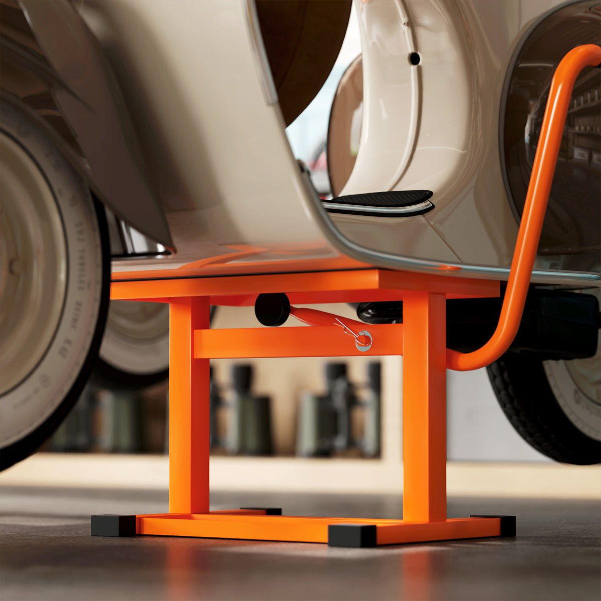 DURHAND orange motorbike lift supporting a scooter, with crank mechanism visible