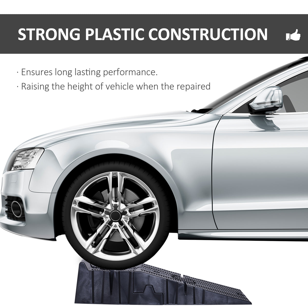 Black plastic car ramp supporting a car's front wheel