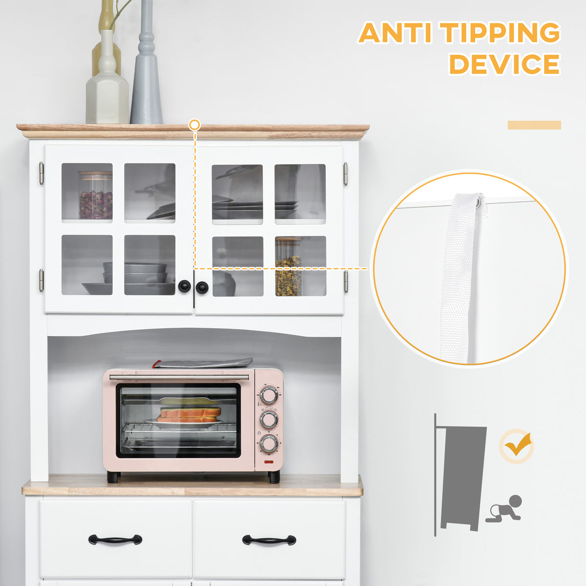 Kitchen cupboard with framed glass doors and close-up of its anti-tip safety strap