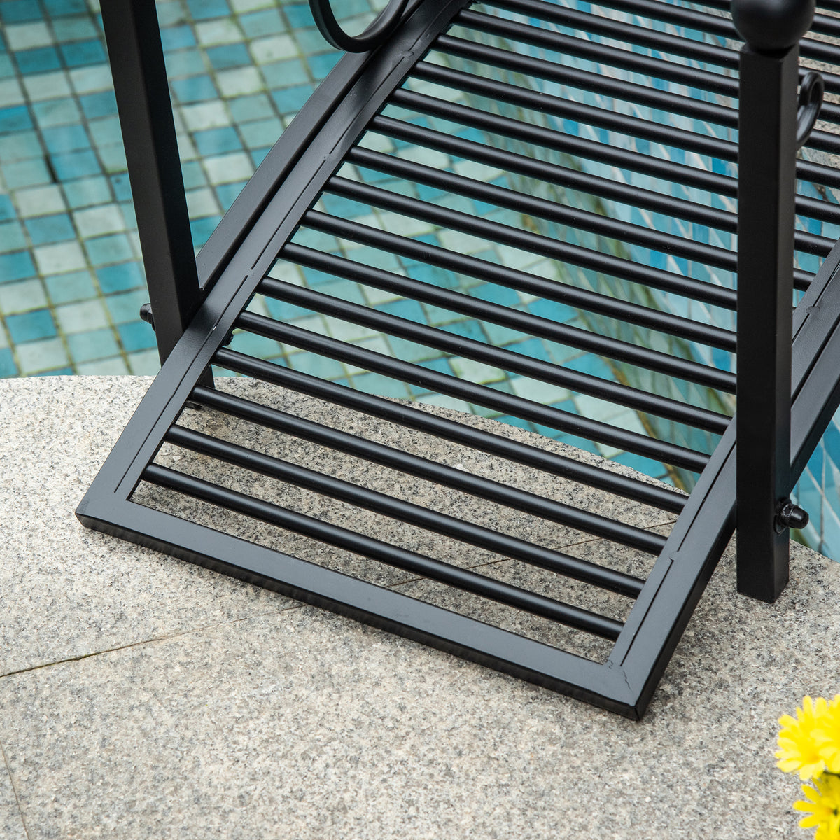 Close-up of the bridge's arched black metal frame and parallel deck slats