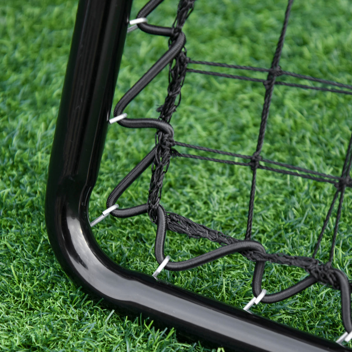 HOMCOM rebounder net close-up showing mesh secured to the black frame with elastic ties