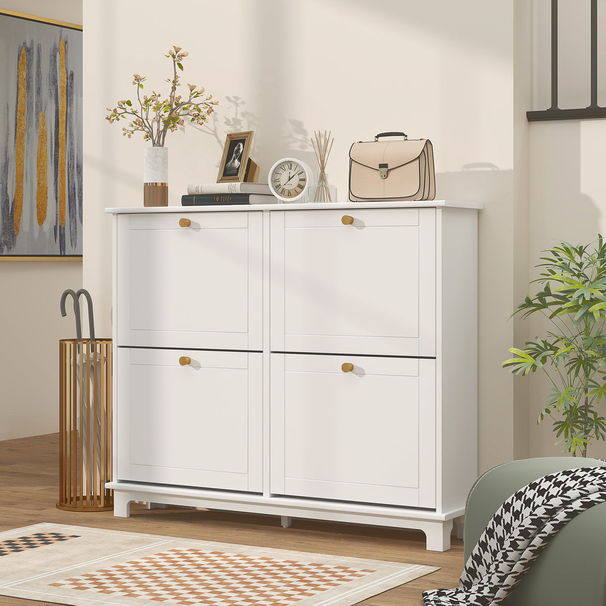 White shoe cabinet with four closed front panels and gold handles