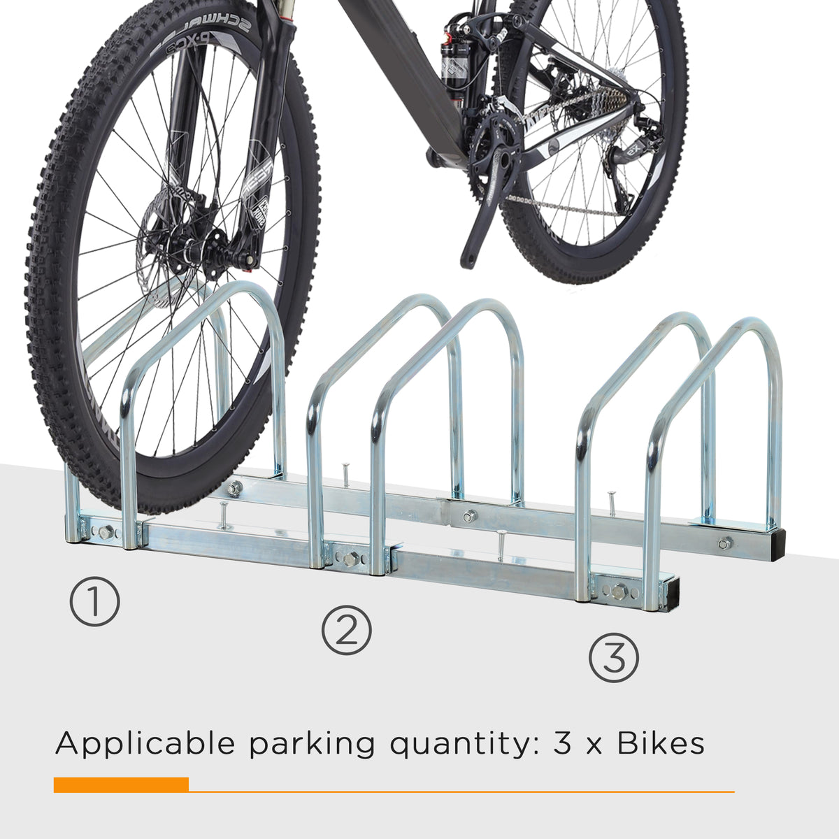 Silver three-slot bike rack holding one bicycle wheel