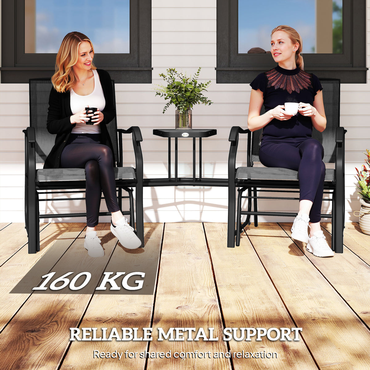 Black gliding patio chairs with a glass-top table and metal frames