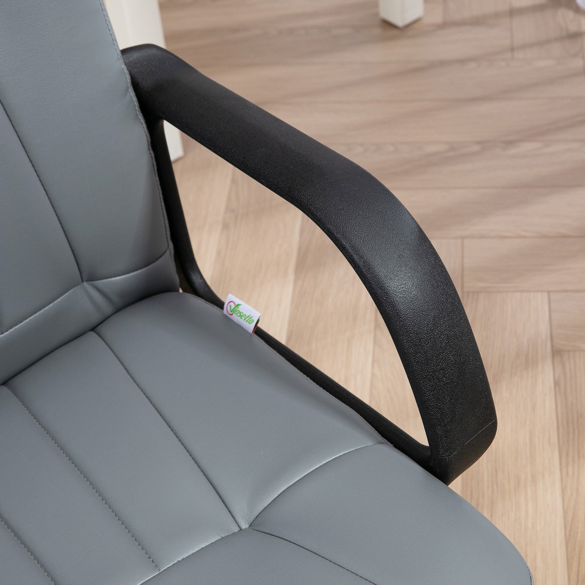 Grey PU leather office chair close-up showing padded seat and black armrest