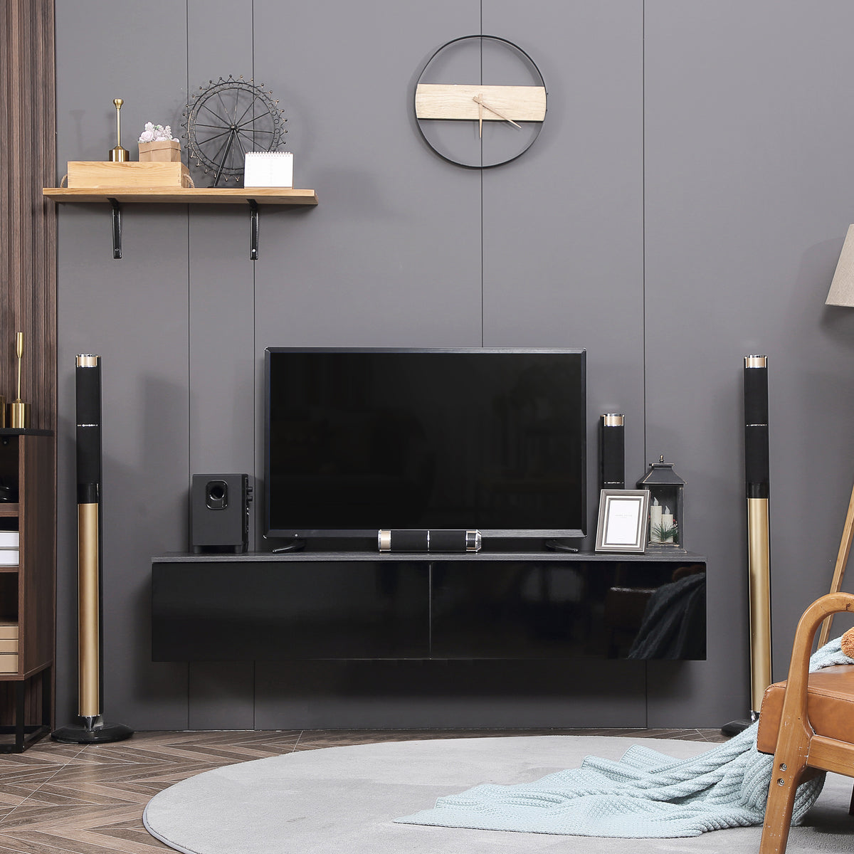 HOMCOM glossy black floating TV cabinet mounted below a television