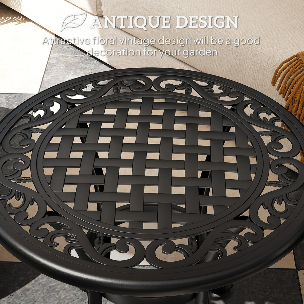 Close-up of the black table's woven lattice center and ornate scrollwork rim