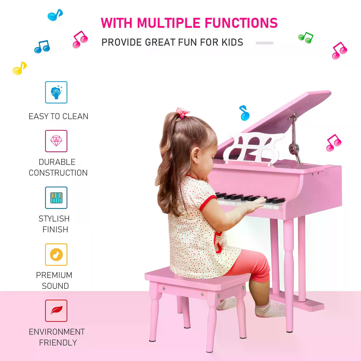 Child playing a pink mini piano with matching bench and raised lid