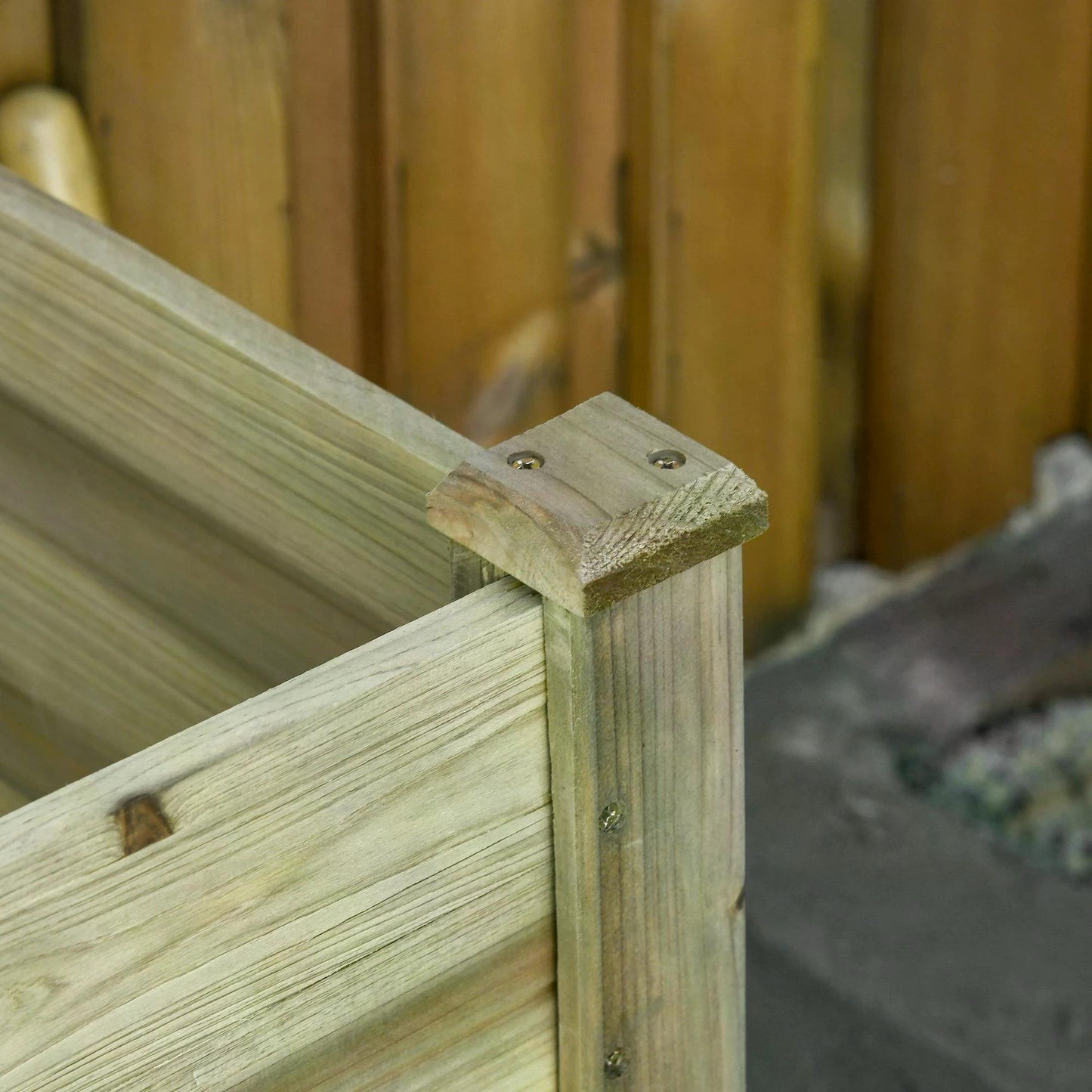 Close-up of a wooden planter's joined corner post and side boards