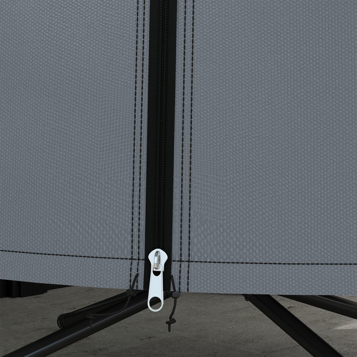 Close-up of the grey cover's front zipper, pull, and bottom drawstring.