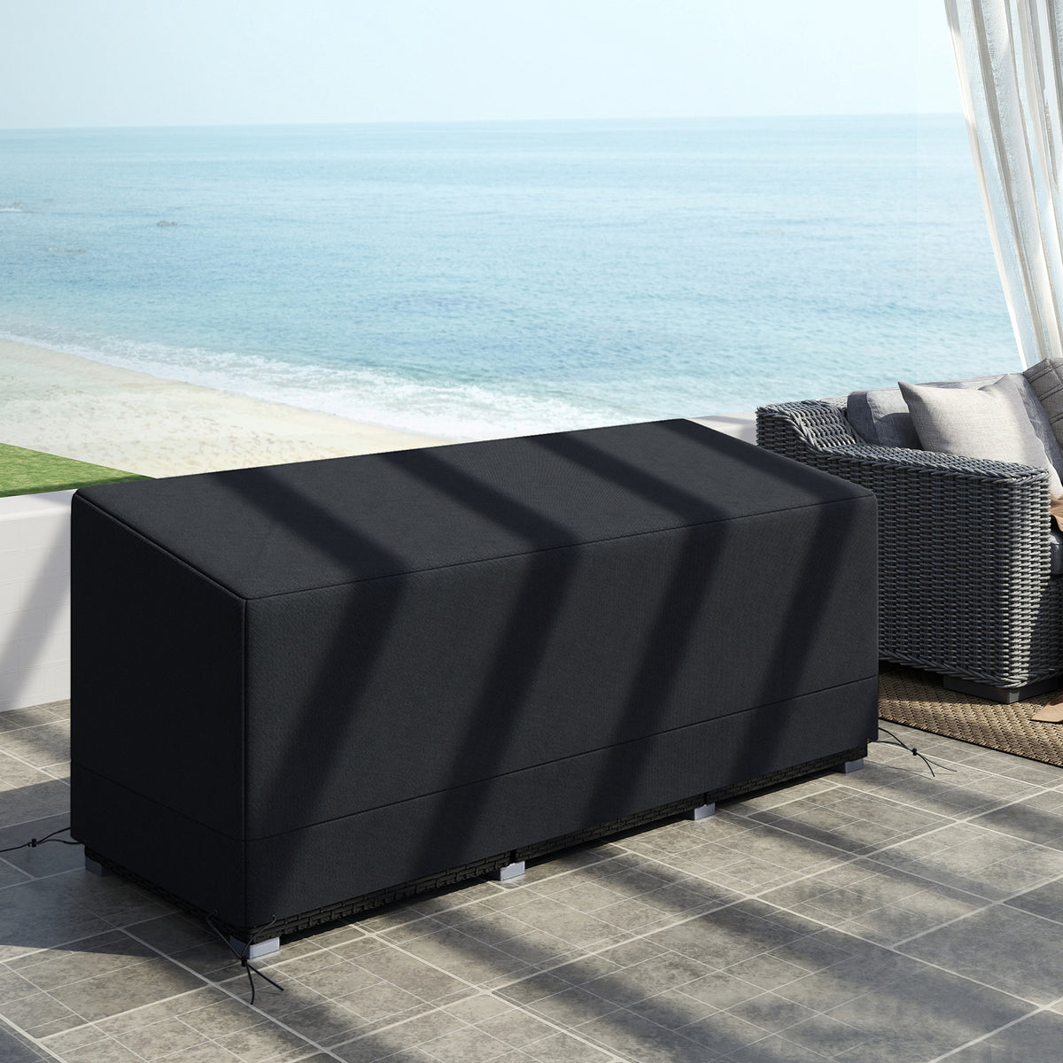Outsunny black patio furniture cover fitted over rectangular outdoor furniture
