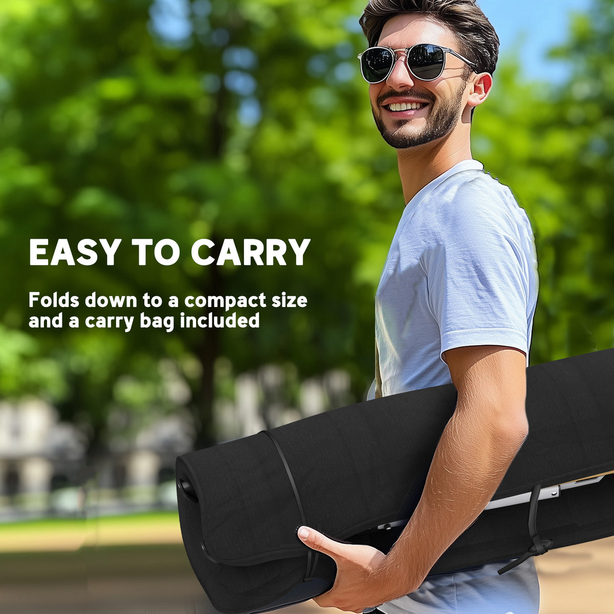 Folded black camping chair carried by hand; a carry bag is included