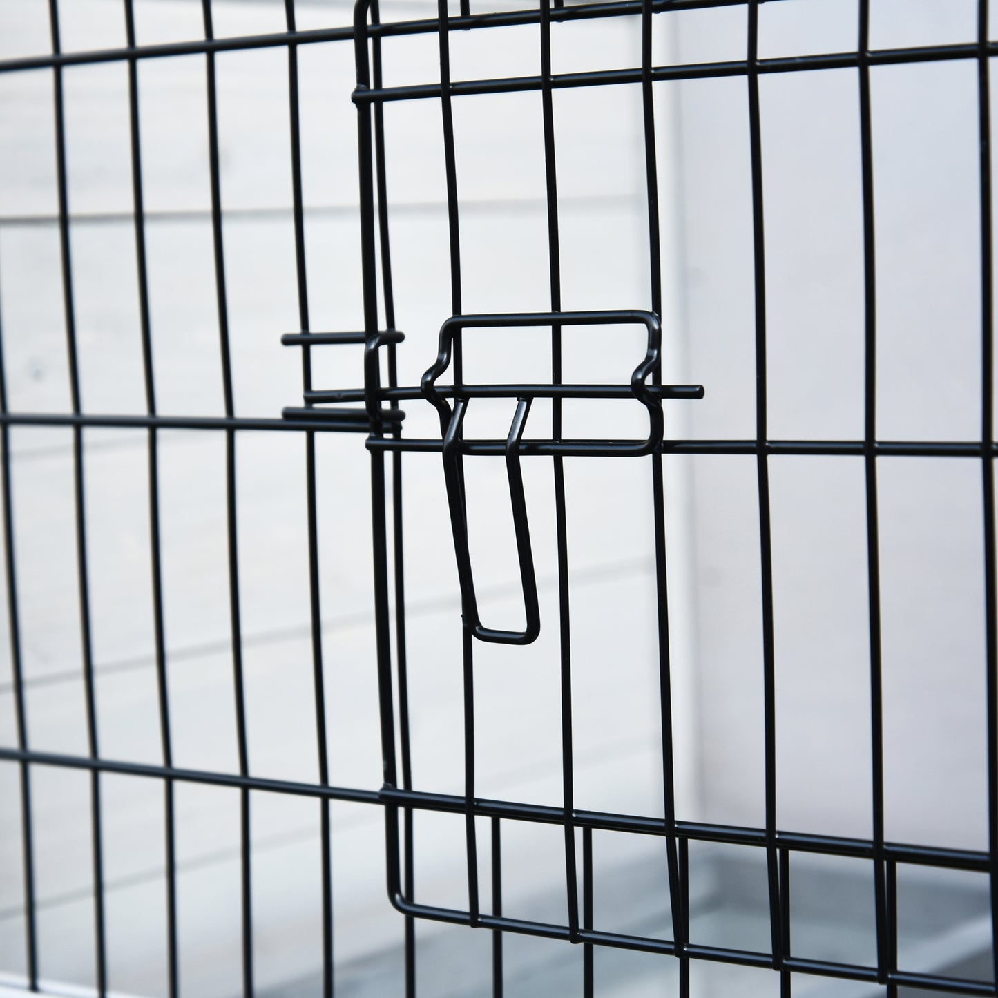 PawHut rabbit hutch close-up of a black wire door latch
