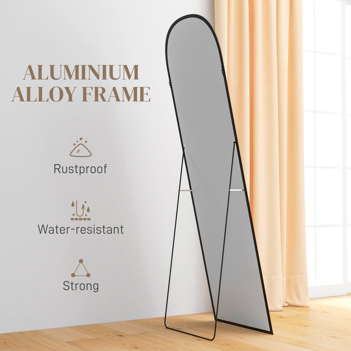 Standing mirror with rounded top, black aluminum frame and folding rear support.
