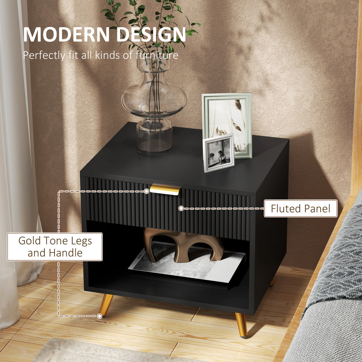 Black bedside table showing fluted drawer front, gold-tone handle and legs, and open shelf