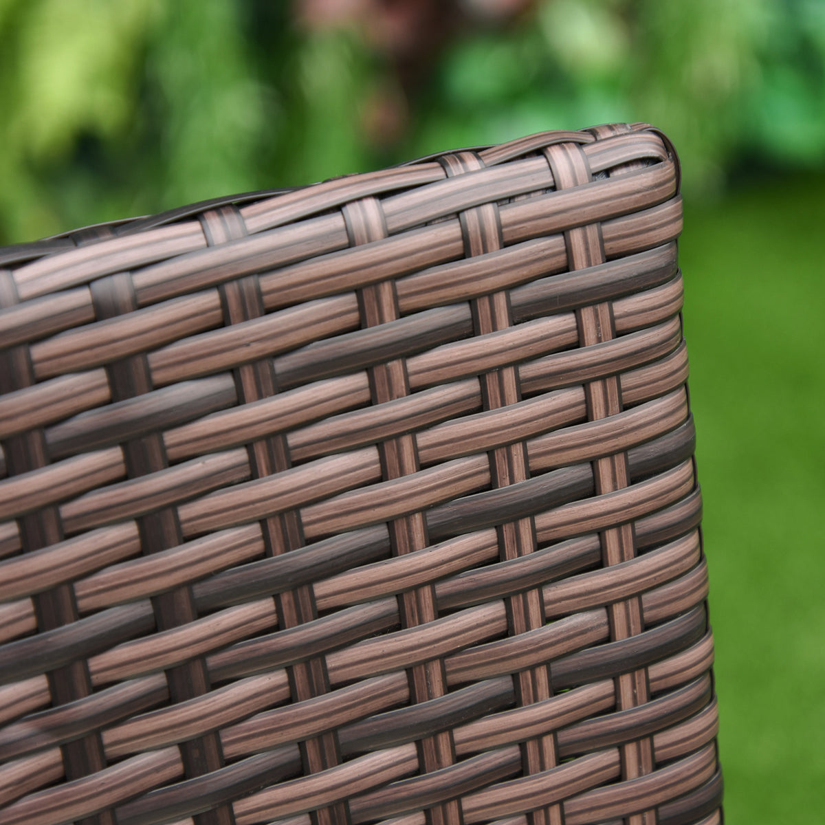 Close-up of the tightly woven brown rattan chair edge