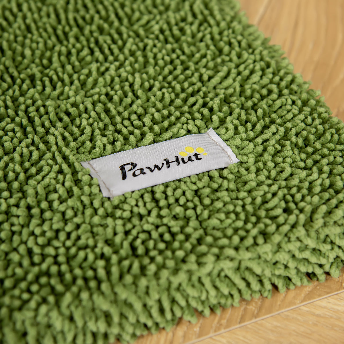 Close-up of green chenille cat tree fabric with PawHut label