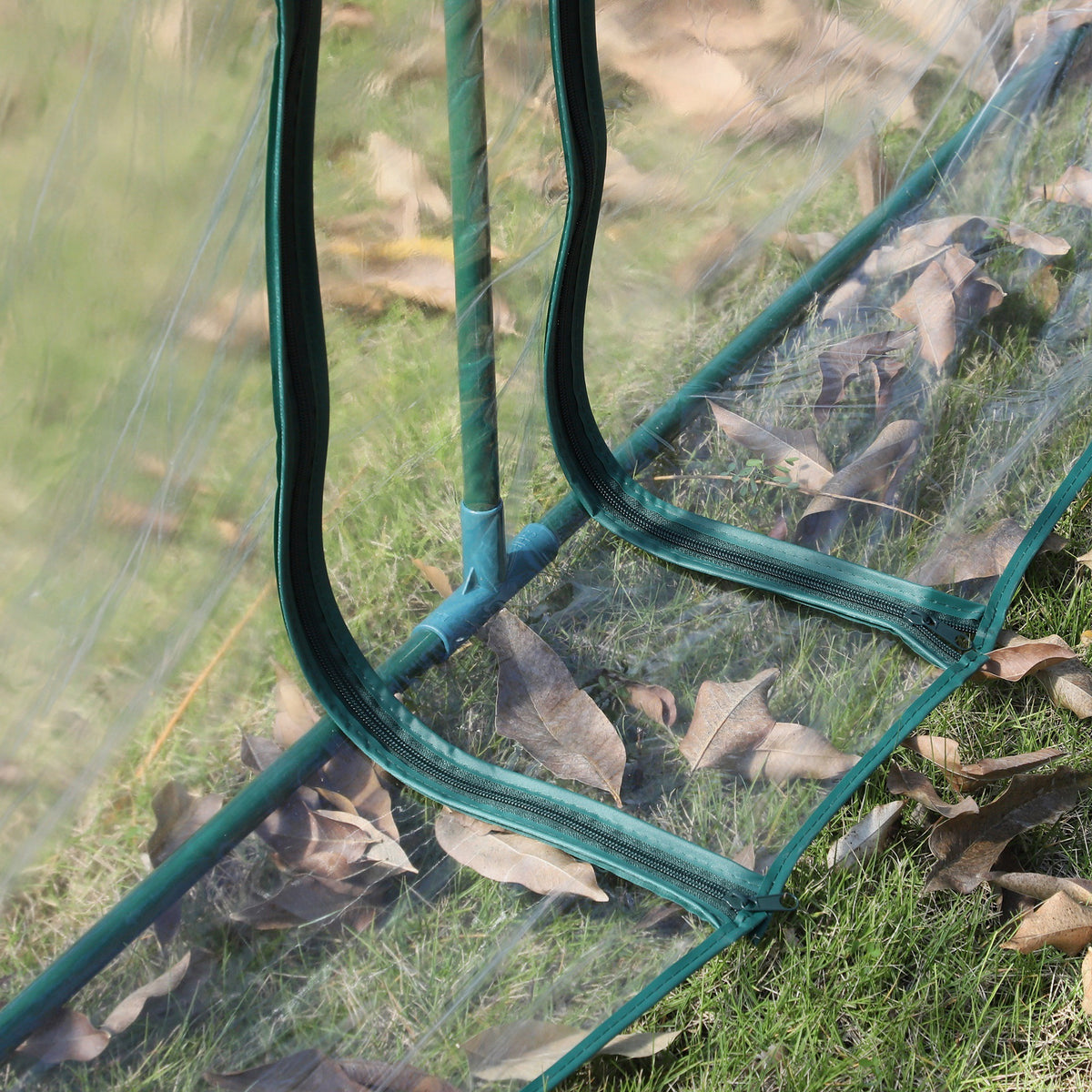 Outsunny mini greenhouse close-up of zipped door edge and steel frame
